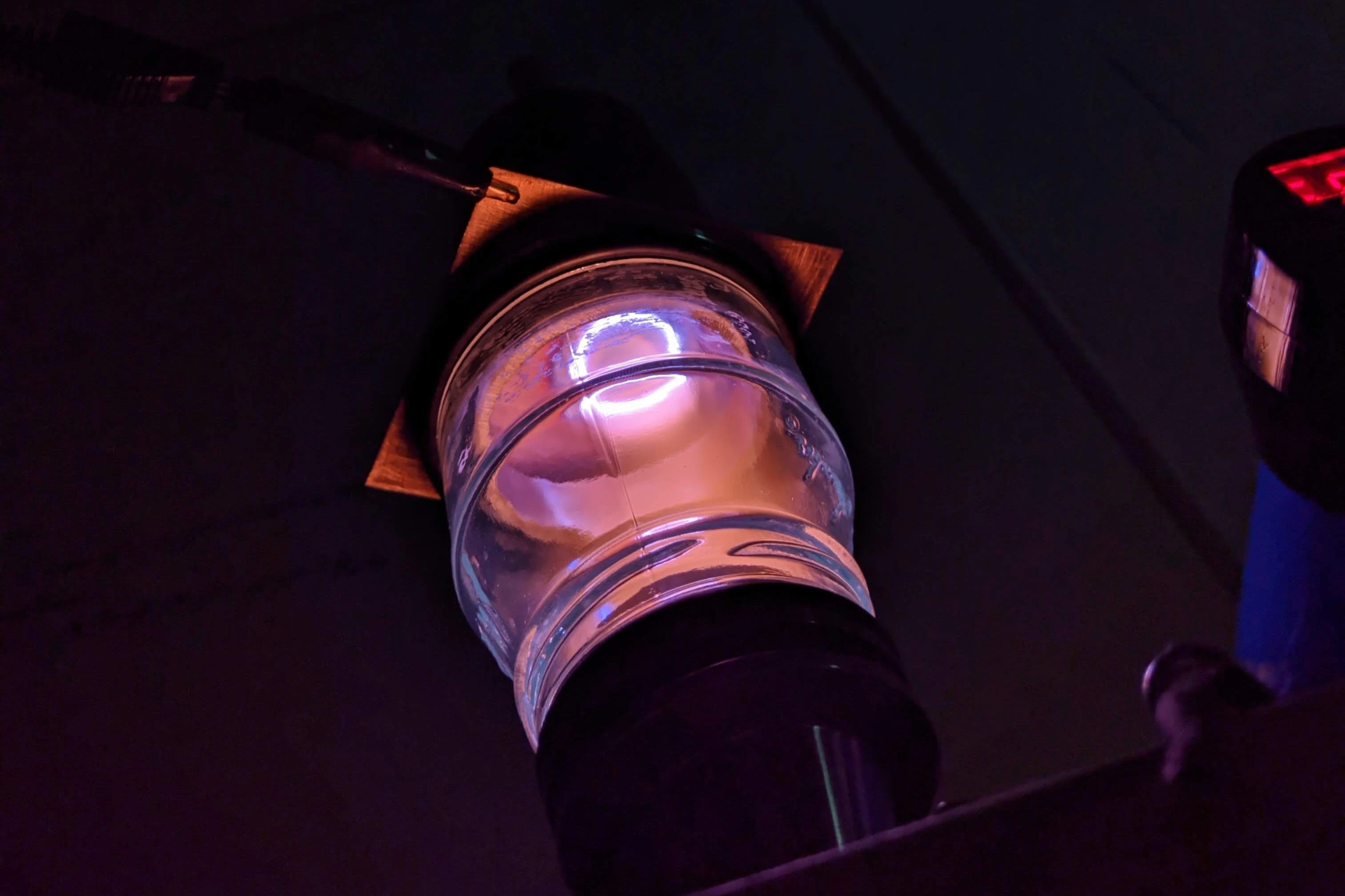 An argon plasma ring on the underside of a copper sheet